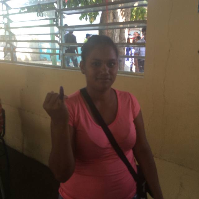 Voter with ink-stained finger.