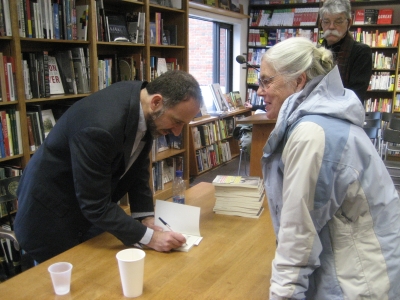 Dean Baker signs a book at Politics and Prose