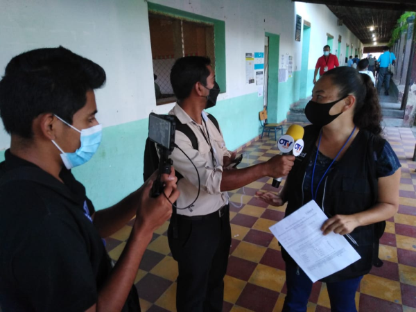 Election observer talking to media