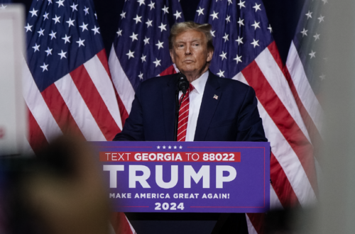 Image of Donald Trump at a podium campaigning in Georgia.