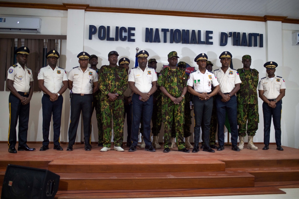 Members of the Kenyan police pose with members of the Haitian police during a press conference at the General Directorate of the Haitian Police (DGPNH) to announce that the Kenyan police forces will participate in the fight against armed gangs, in Port au Prince, Haiti, on July 8, 2024 as part of Haiti's Path Free Fair Elections (Photo by Clarens SIFFROY / AFP) (Photo by CLARENS SIFFROY/AFP via Getty Images)