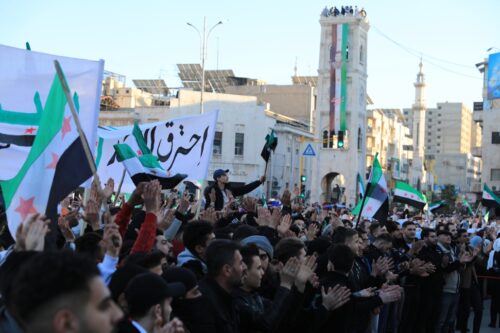 Hundreds of Syrians in Hama celebrate end of Assad era HAMA, SYRIA - DECEMBER 19: Syrians celebrate the fall of the Baath Party's 61-year regime and the fleeing of its leader, Bashar al-Assad, with Syrian revolution flags, anthems, and songs in Hama, Syria on December 19, 2024. (Photo by Hisam Hac Omer/Anadolu via Getty Images)