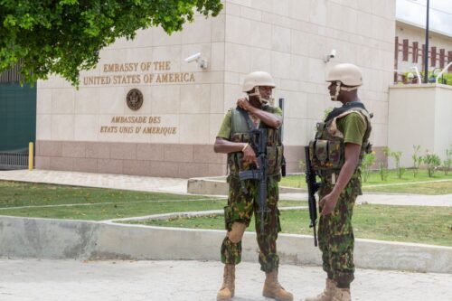 PORT-AU-PRINCE, HAITI - JULY 05: Kenyan police stand guard outside the US embassy in Port-au-Prince, while a number of Kenyan police officers were stationed outside the US embassy in Port-au-Prince, Haiti July 05, 2024. Meanwhile, armed bandits continue to wreak havoc in many parts of Haiti, particularly in the commune of Gressier, Carrefour and the surrounding area. (Photo by Guerinault Louis/Anadolu via Getty Images)