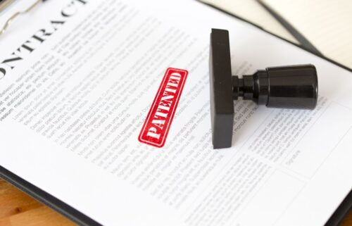 A close-up of a contract document with a bold red 