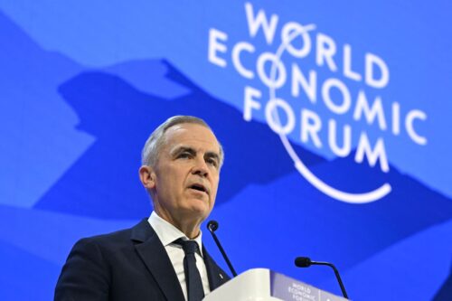 Canada's Prime Minister Mark Carney delivers a speech during the World Economic Forum (WEF) annual meeting in Davos on January 20, 2026. The World Economic Forum takes place in Davos from January 19 to January 23, 2026. (Photo by Fabrice COFFRINI / AFP via Getty Images)