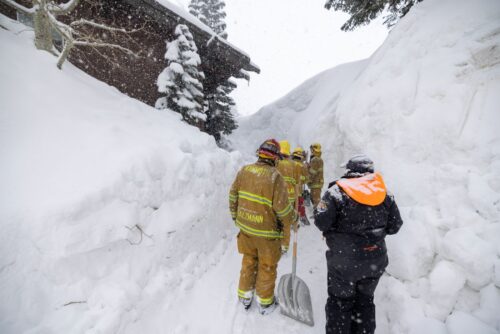 MAMMOTH LAKES, CA - Firefighters are blocked by snow from investigating a possible propane tank alarm at a house that is already red tagged because it is in danger of collapsing under the weight of snow, which continues to deepen. (Photo by David McNew/Getty Images)