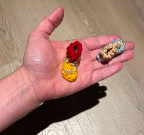 Small shoes knit to represent victims of "false positives"