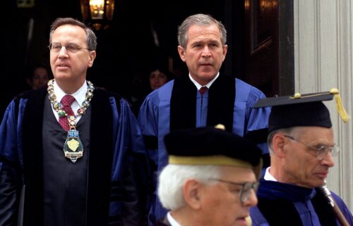 NEW HAVEN, CT - MAY 21: US President George W. Bush walks in the processional with Yale University President D. Richard Levin (L) prior to Yale commencement ceremonies 21 May, 2001, in New Haven, Connecticut. The President received an honorary Doctorate of Laws degree during the commencement. Bush graduated from Yale in 1968. (Photo credit should read SHAWN THEW/AFP via Getty Images)
