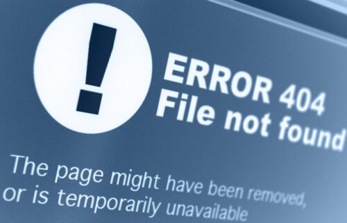 Close-up of a digital screen displaying 'ERROR 404 File not found' in bold white text on a blue background, conveying an unavailable webpage.