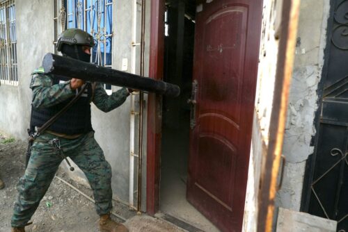 A security forces officer carries out a raid during a joint operation between the national police and the armed forces in the 