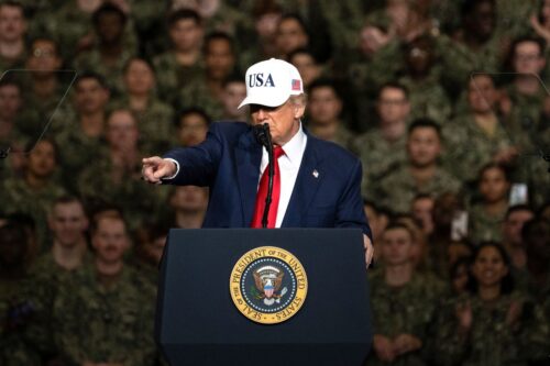 TOPSHOT - US President Donald Trump gestures as he delivers a speech to US Navy personnel on board the US Navy's USS George Washington aircraft carrier at the US naval base in Yokosuka on October 28, 2025. (Photo by Philip FONG / AFP) (Photo by PHILIP FONG/AFP via Getty Images)
