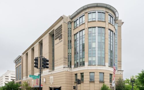 The Universal Health Services building featuring multiple windows, showcasing a modern architectural design.